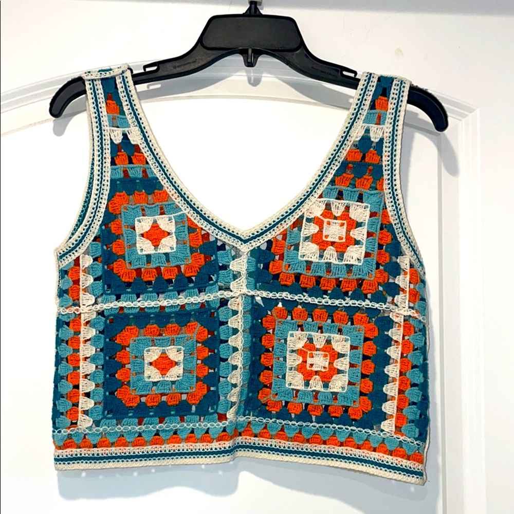Crochet cropped vest.
